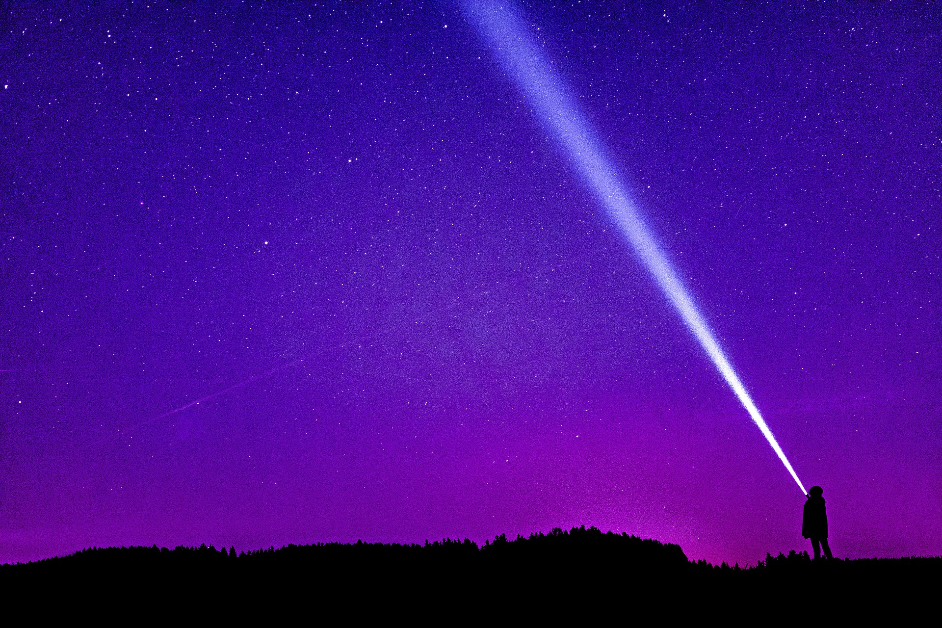 Photo showing a person focusing on star trails